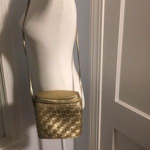 Gold woven bucket style handbag buy saddle River